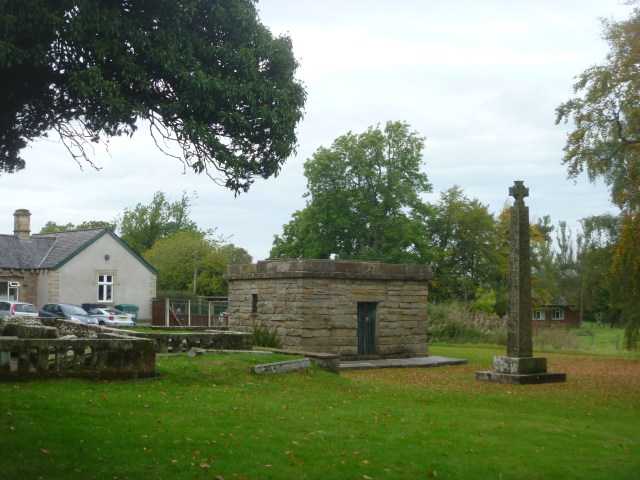 Mausoleum and cross and school