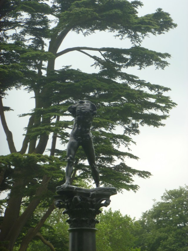 Walking man on column