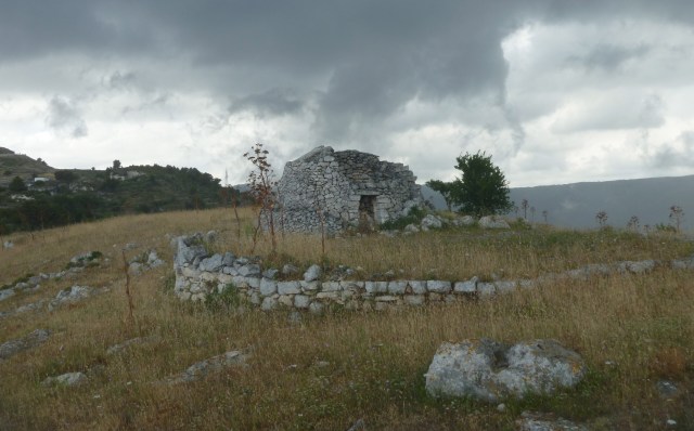a pagliaio and storm clouds