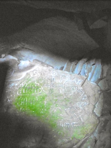 Stone carvings within Cairn T